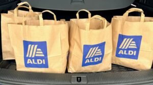 : Aldi blind boxes giveaway — colorful mystery boxes with Aldi branding on a bright background