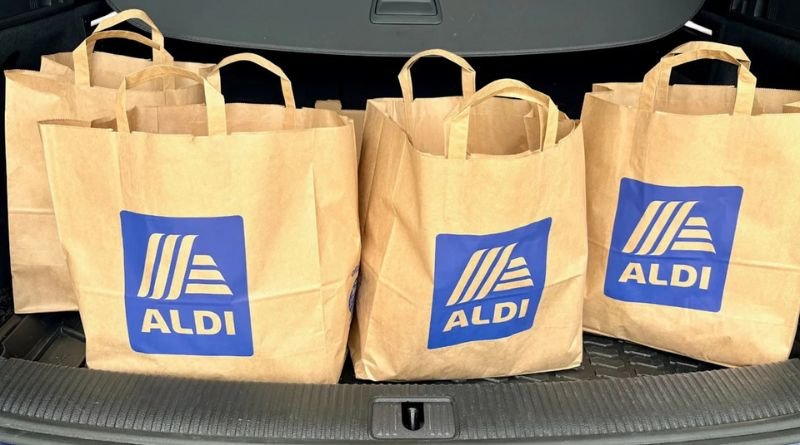 : Aldi blind boxes giveaway — colorful mystery boxes with Aldi branding on a bright background